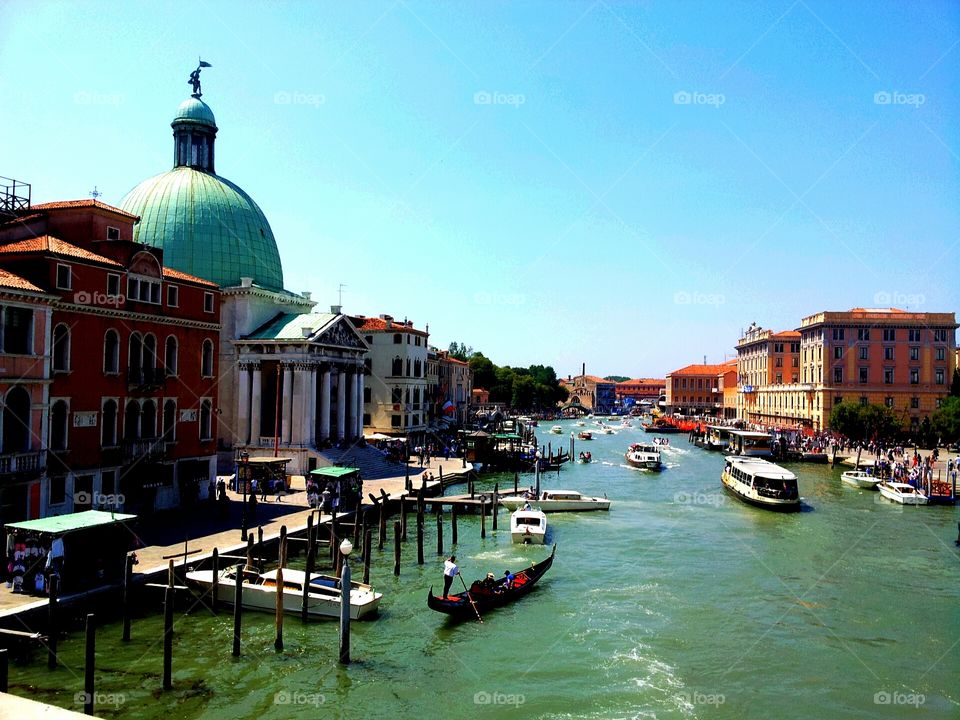 Venice is a city in northeastern Italy sited on a group of 117 small islands separated by canals and linked by bridges. 
Beautiful canals boats, gondolas just gorgeous!