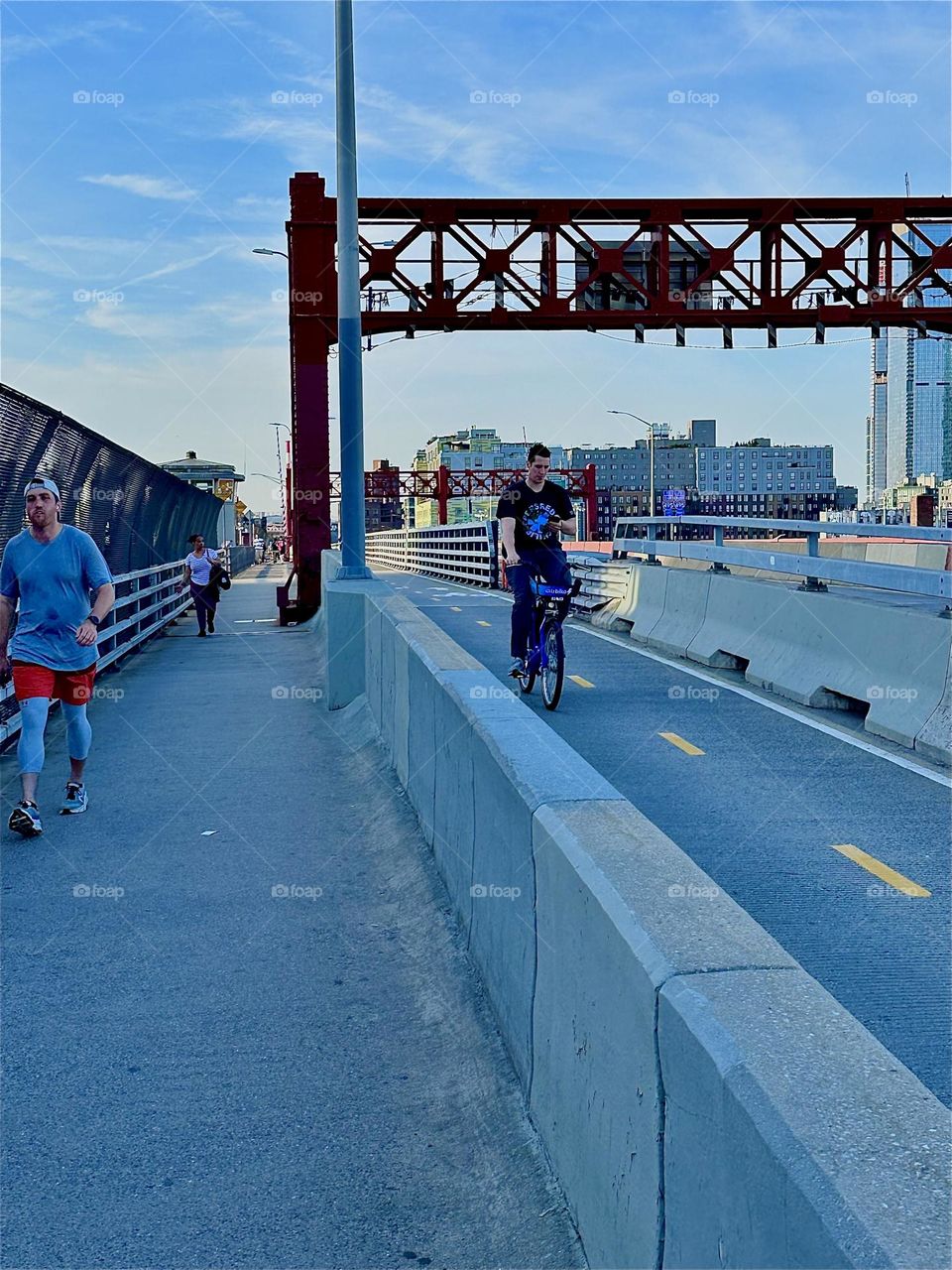 This is the “Pulaski Bridge” that connects “Greenpoint”, Brooklyn to LIC, Queens in the direction we are currently facing. It has a pedestrian and a bicycle lane on either side and car lanes in the middle. 2024. Hypnotic Productions