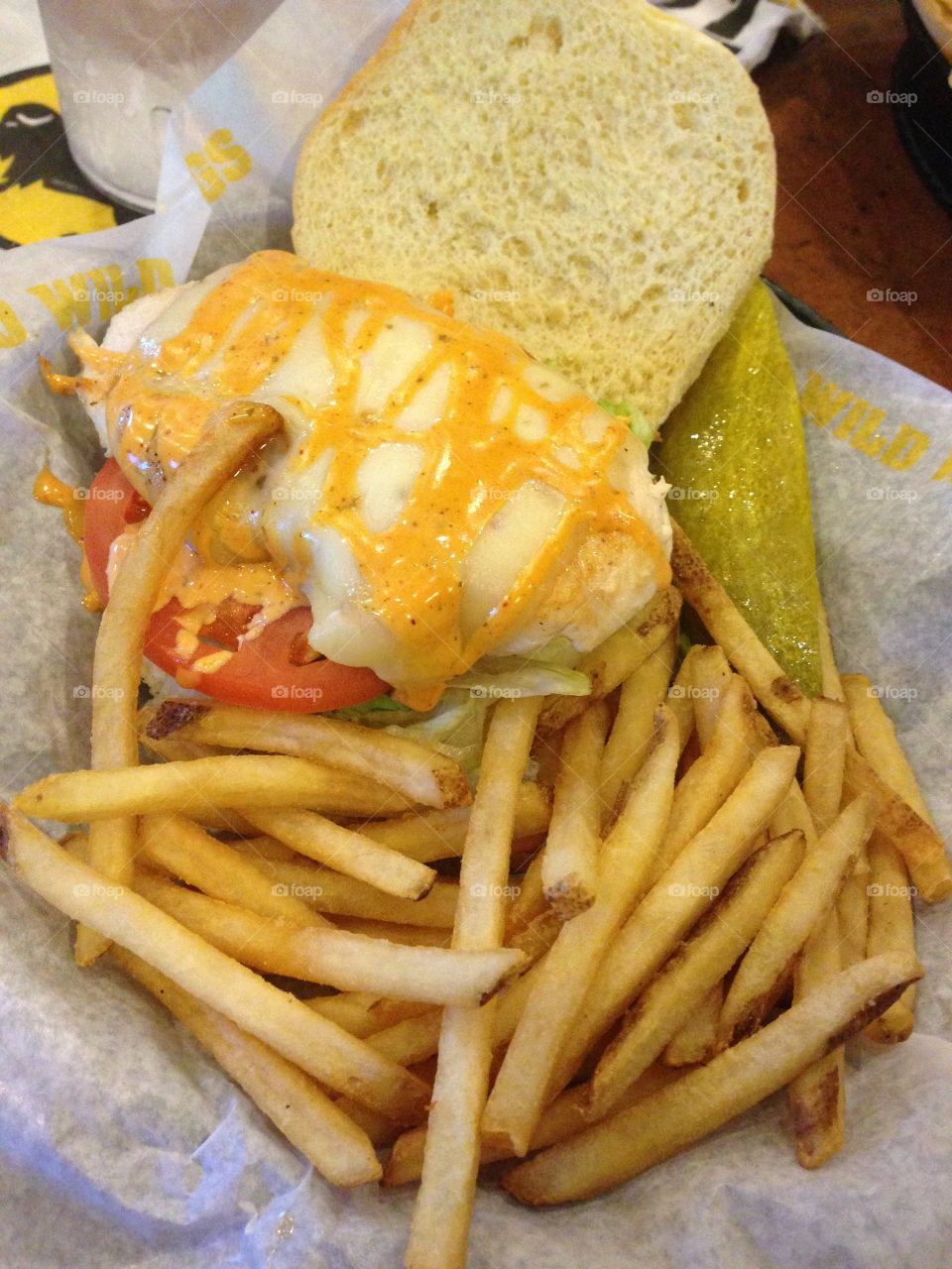 American chicken sandwich with french fries lettuce and tomato