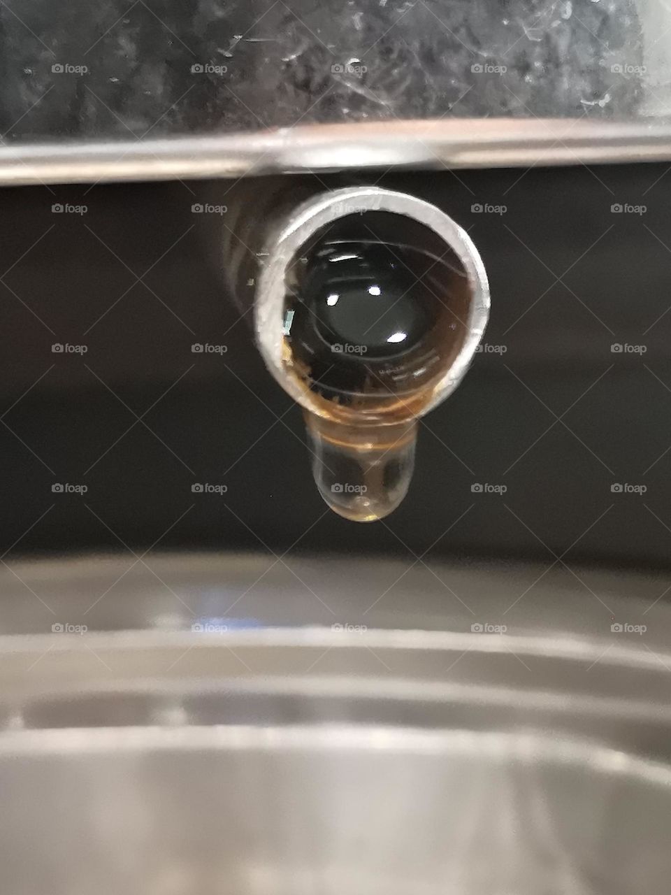 Captured this water droplet on freezer draining pipe