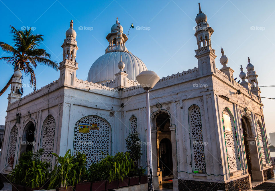 The Haji Ali Dargah is a mosque and dargah (tomb) or the monument of Pir Haji Ali Shah Bukhari located on an islet off the coast of Worli in the southern part of Mumbai.- wiki