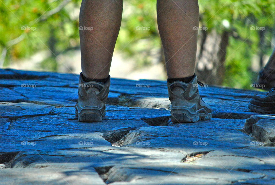 hiking shoes on top of mountain with a view