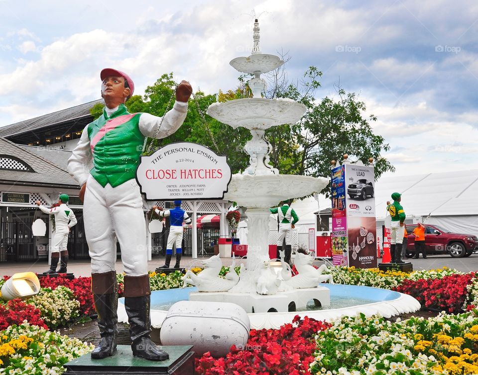 Close Hatches. Last year's major stakes winners at the Spa get their owner's colors painted on the iconic lawn jockeys.
Fleetphoto