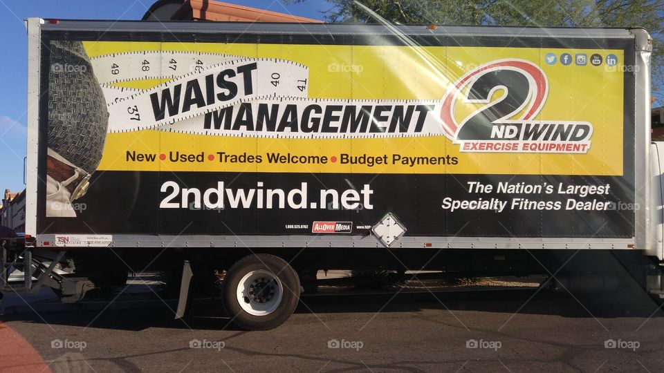 yellow Waist Management truck