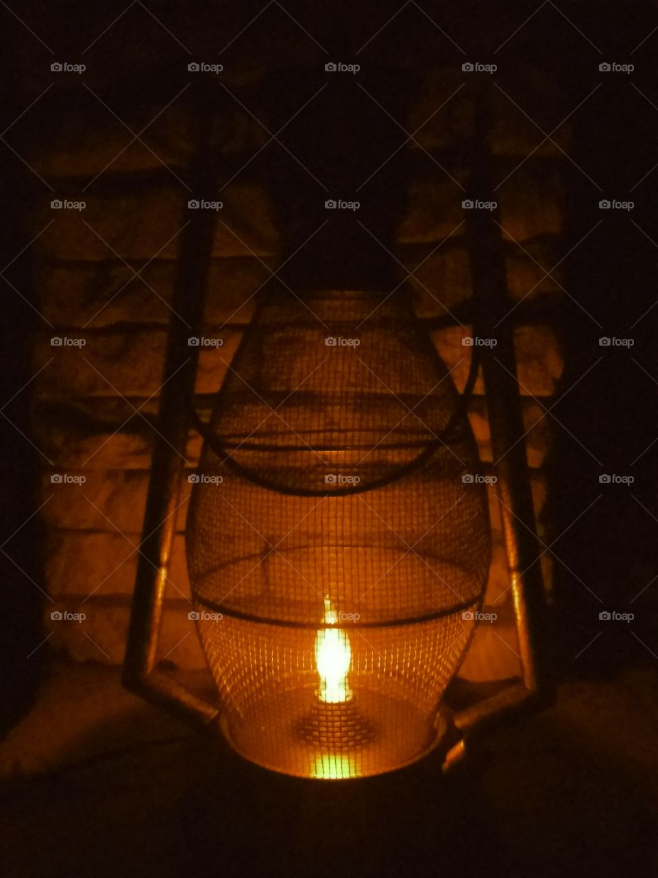 soft glow of lantern light sitting on the hearth