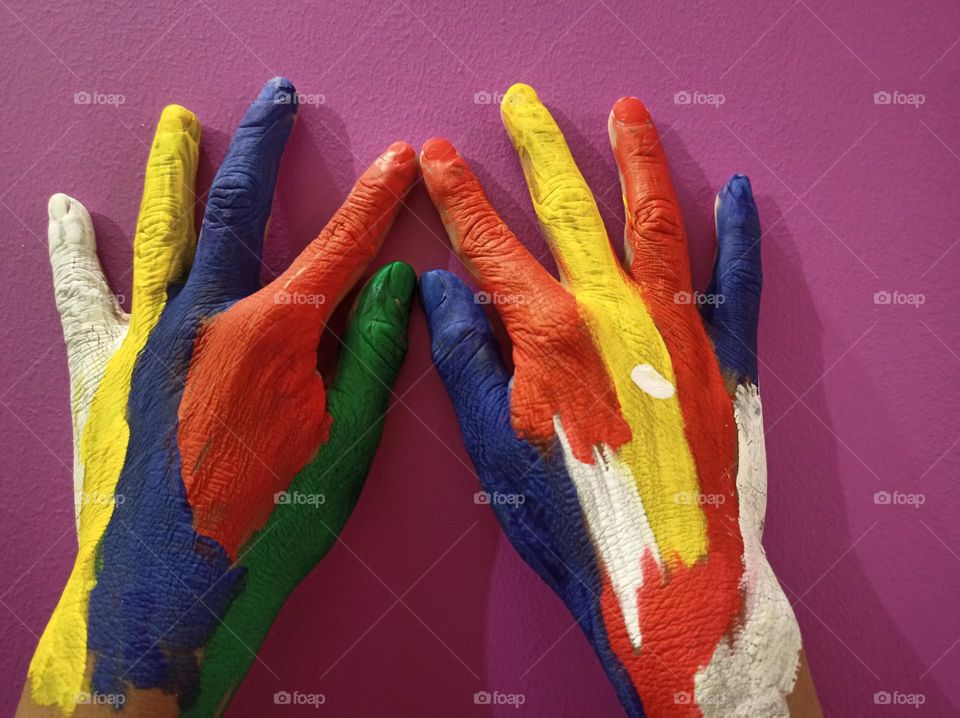 Colours splash 
Human hands painted with multi colours