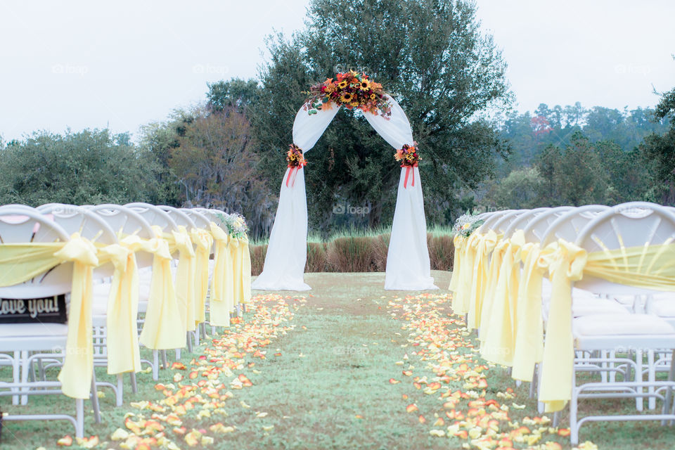Classic Florida wedding decor with yellow bows and ribbons