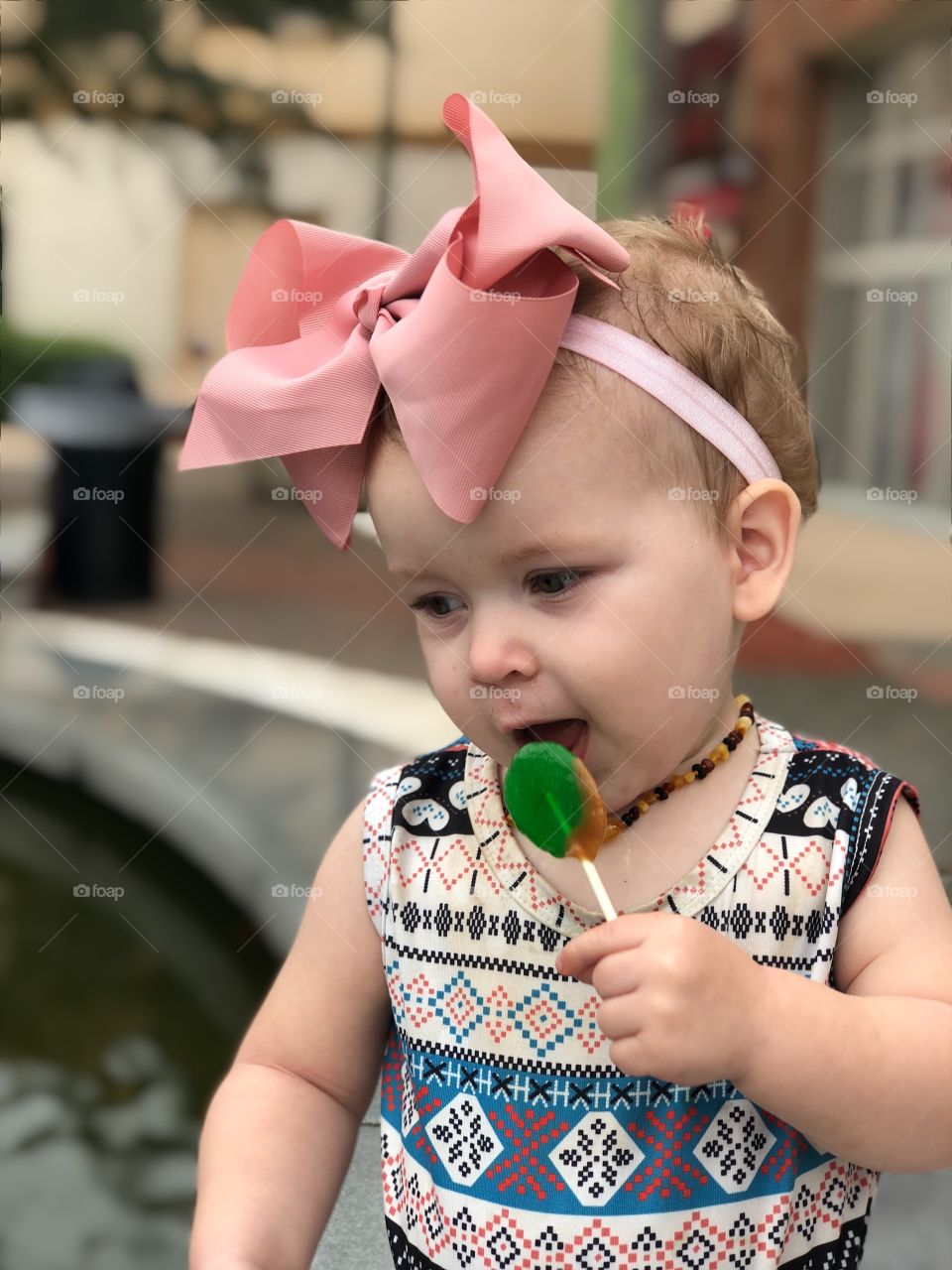 Little girl loves caramel apple suckers