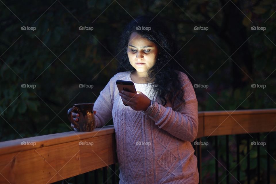 Woman standing outside with mobile