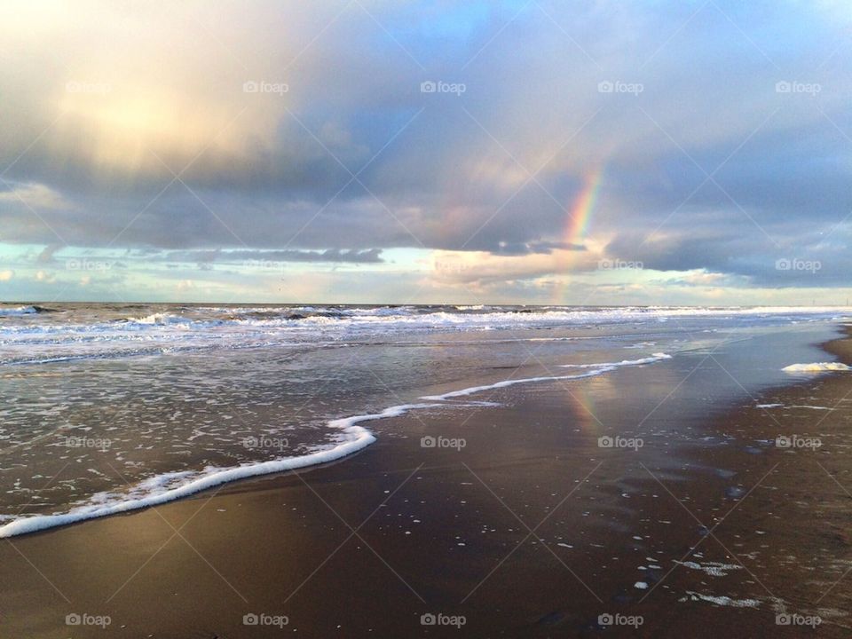 Rainbow at sea after rainfall