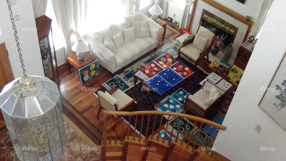 A room full of paintings is a sign of an artist's house.