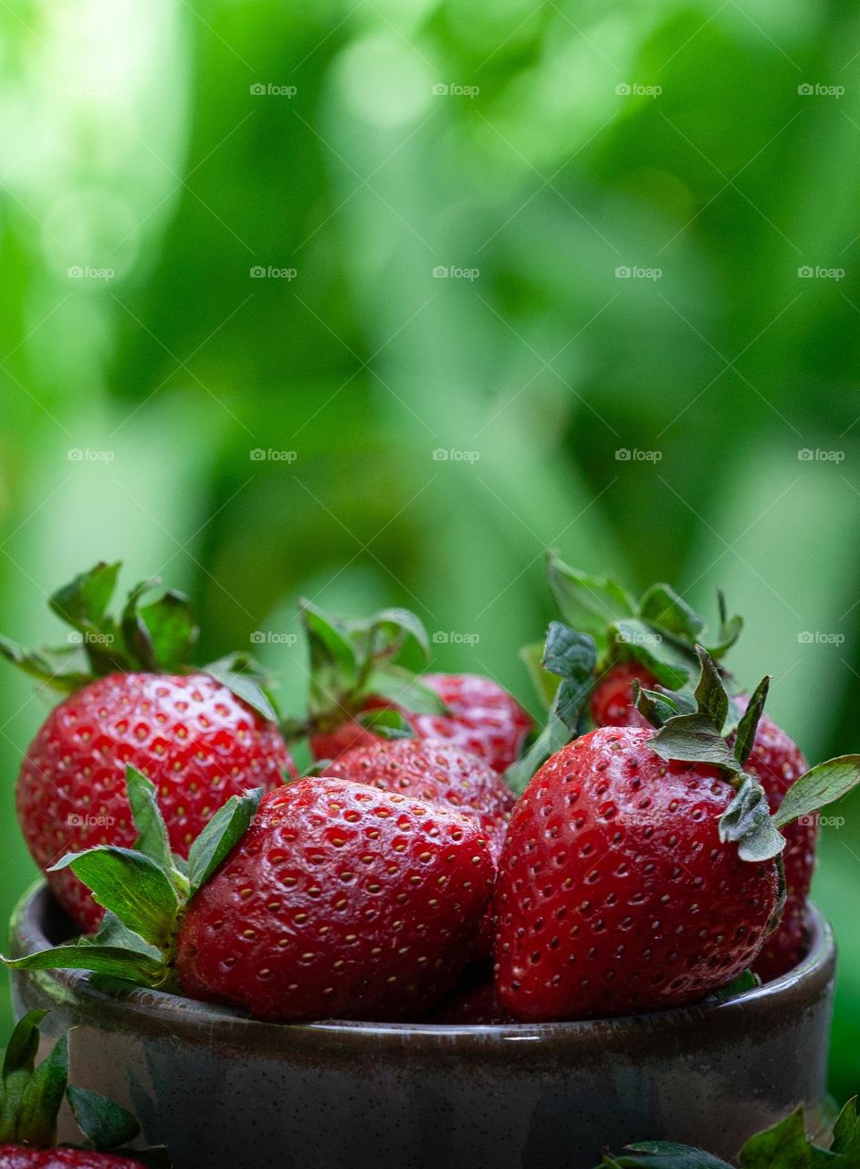 Strawberries and green background 