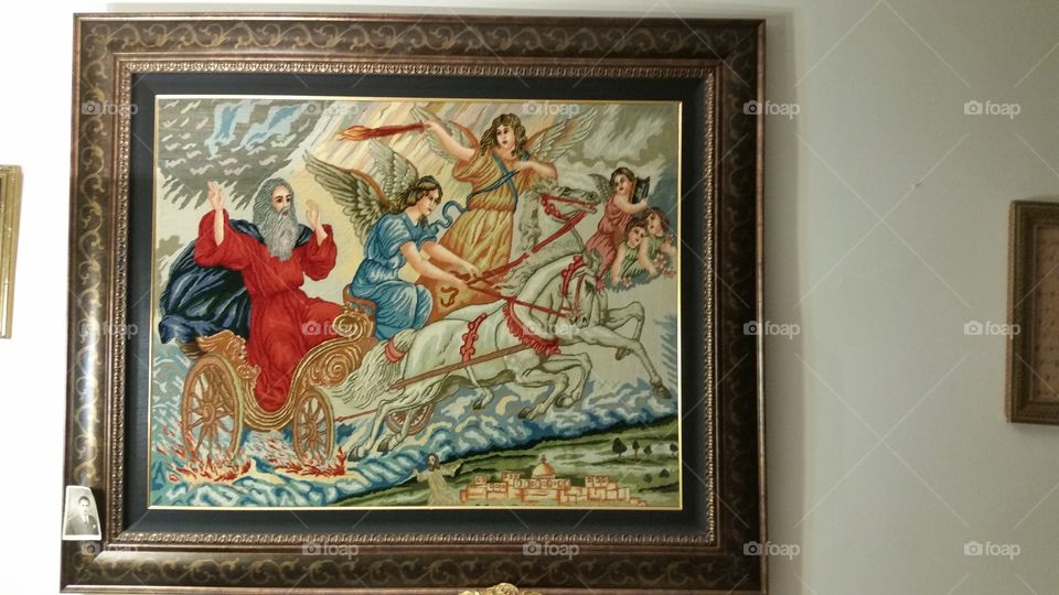 Moses riding on chariot with Angels