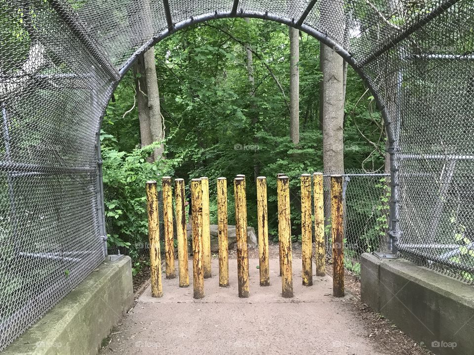 Park fence poles bridge security entryway entrance archway