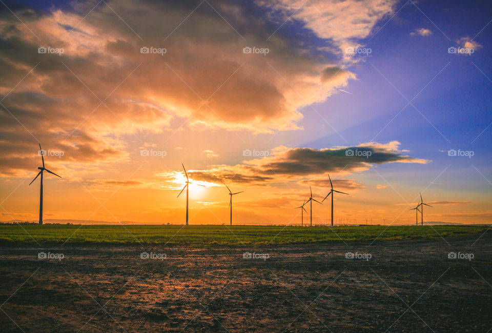 wind turbines during sunset