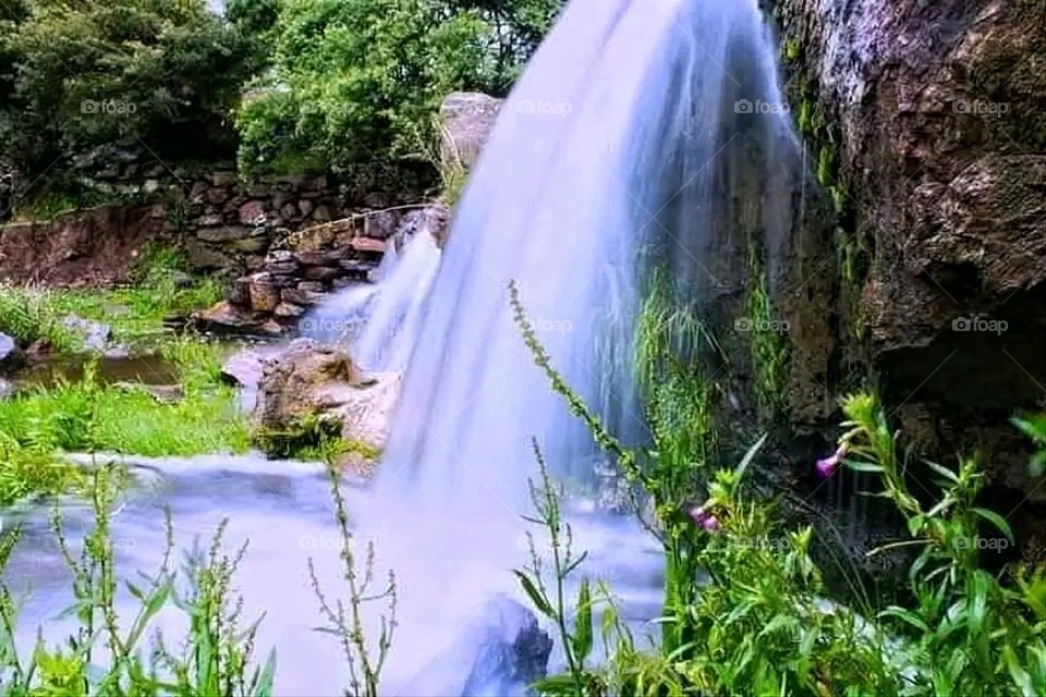A stunning view of green mountains covered in fog in Yemen