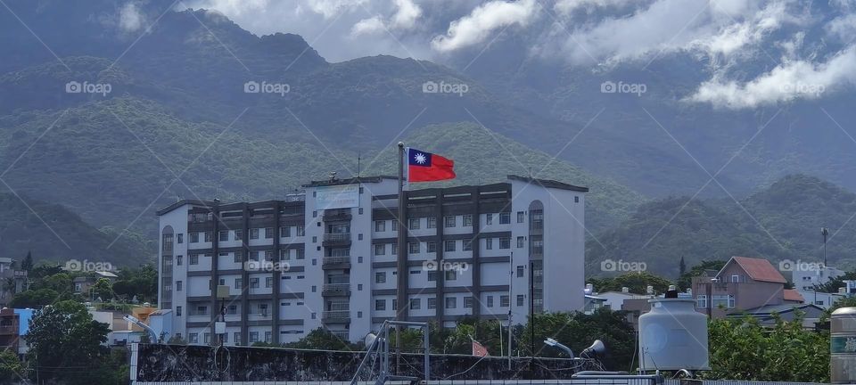 Landscape painting of a small town on the shore of the Pacific Ocean