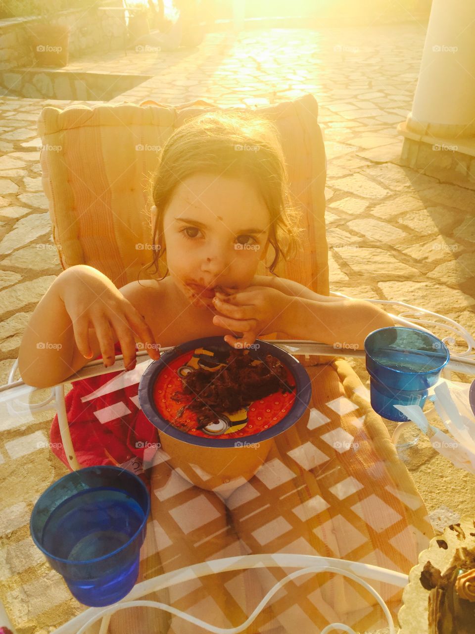 Little girl eating sweet food