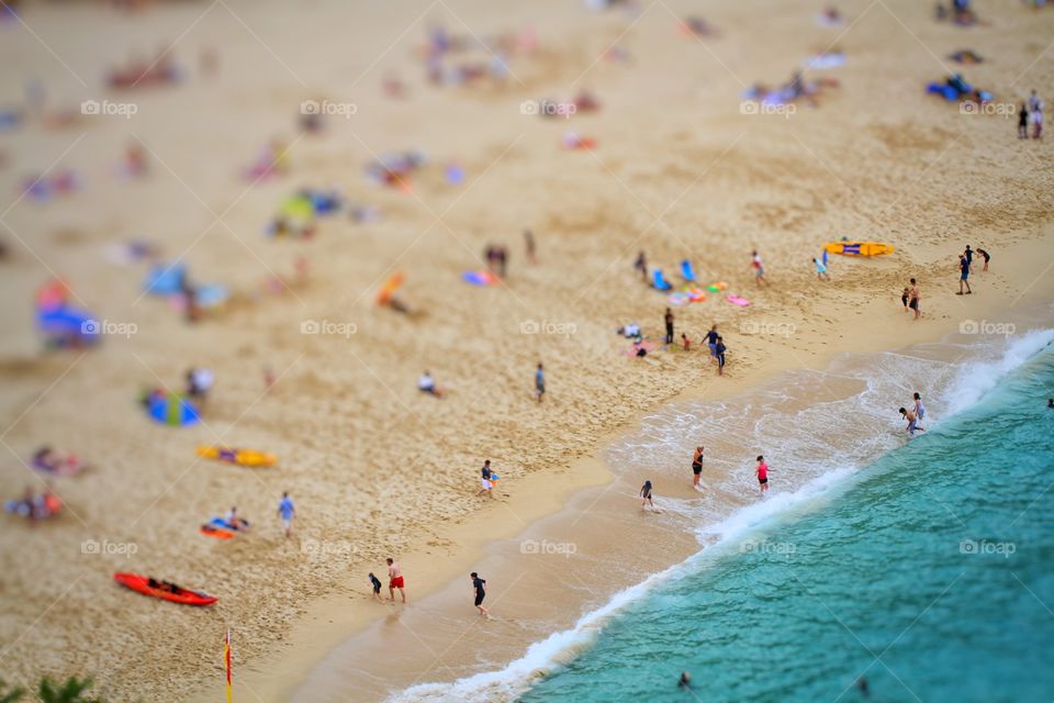 Beach Activites. A busy beach full of holidaymakers having fun and keeping active and healthy. Birds eye view.