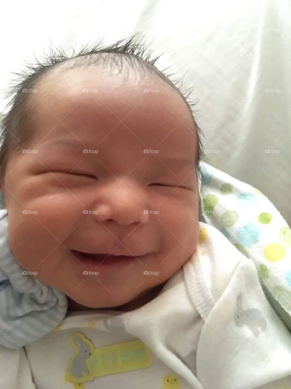 Smiling baby while asleep.