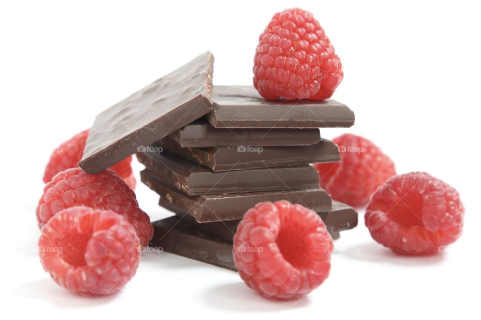Raspberry with chocolate against white background