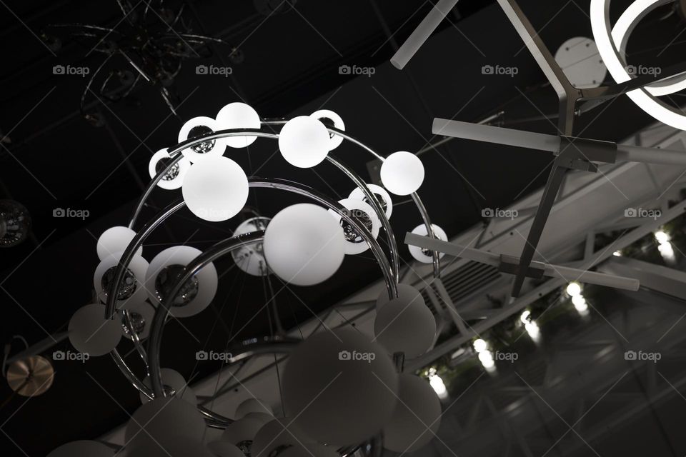 Low angle view of modern chandelier . Abstract background