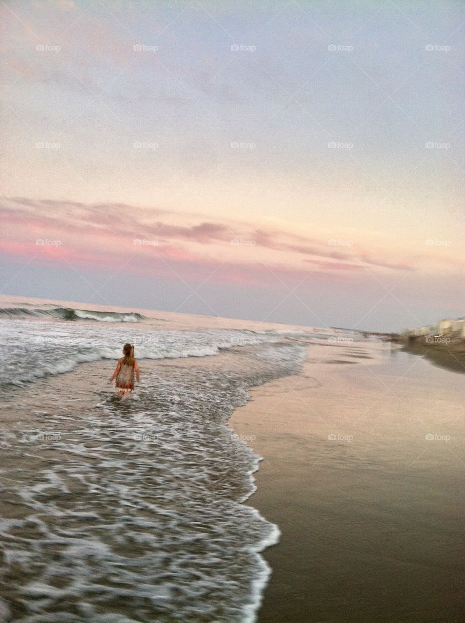 One Girl Walking on Beach