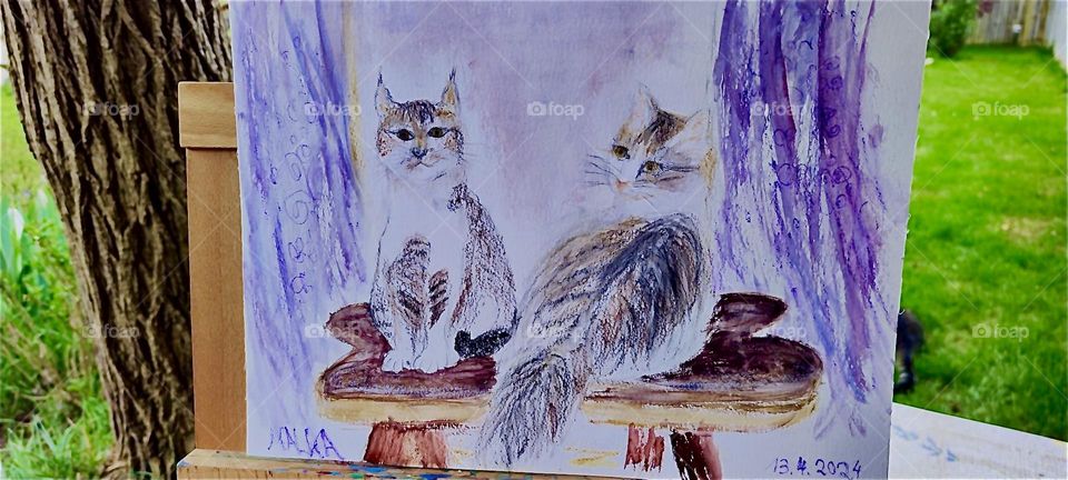 This is a lovely hand drawn portrait of “Roukey” and “Linda”, two sibling cats who live in rural “Bavaria”, Germany. It is displayed outside on an easel on the terrace overlooking the garden. 2024. Hypnotic Productions