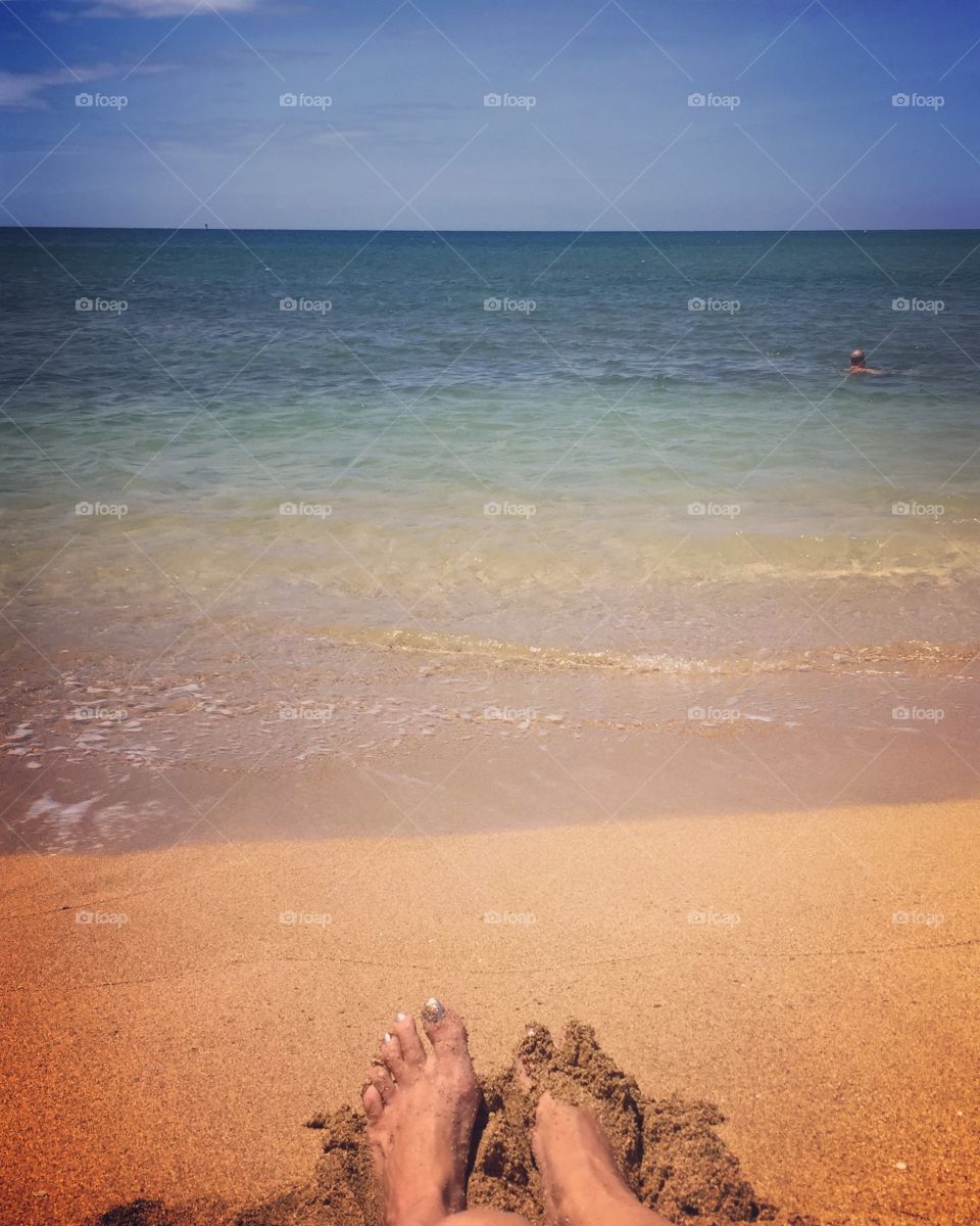 Feet in the sand