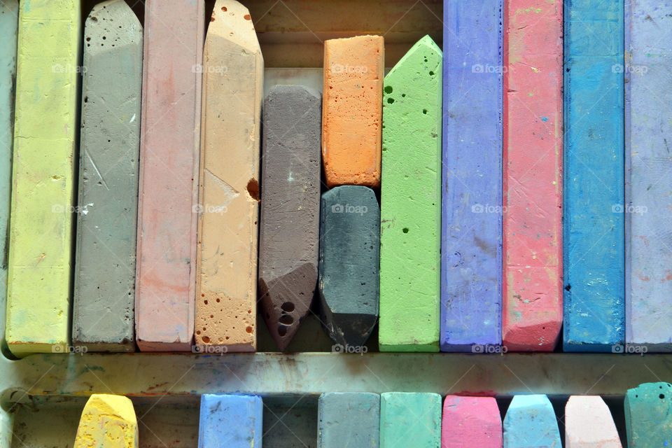 Colorful chalks in container