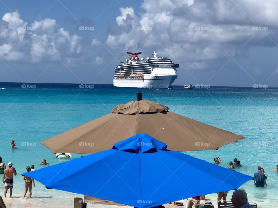 The Carnival Cruise Optical Illusion. Is it on top of the umbrellas?