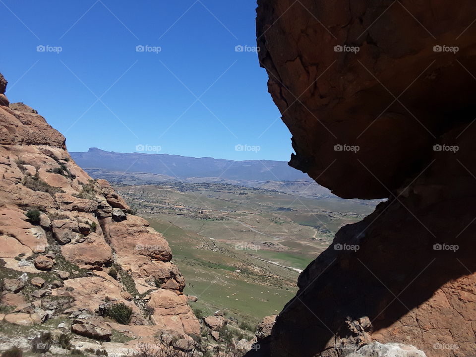 A mountain view between rocks.