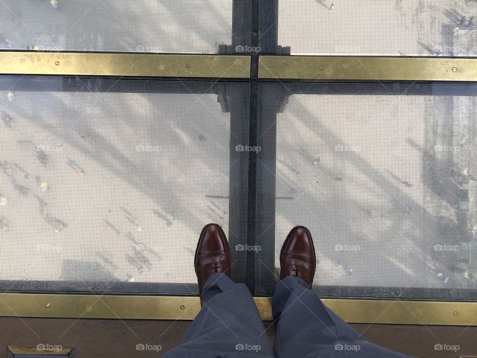 View through the glass floor of the Eiffel Tower 