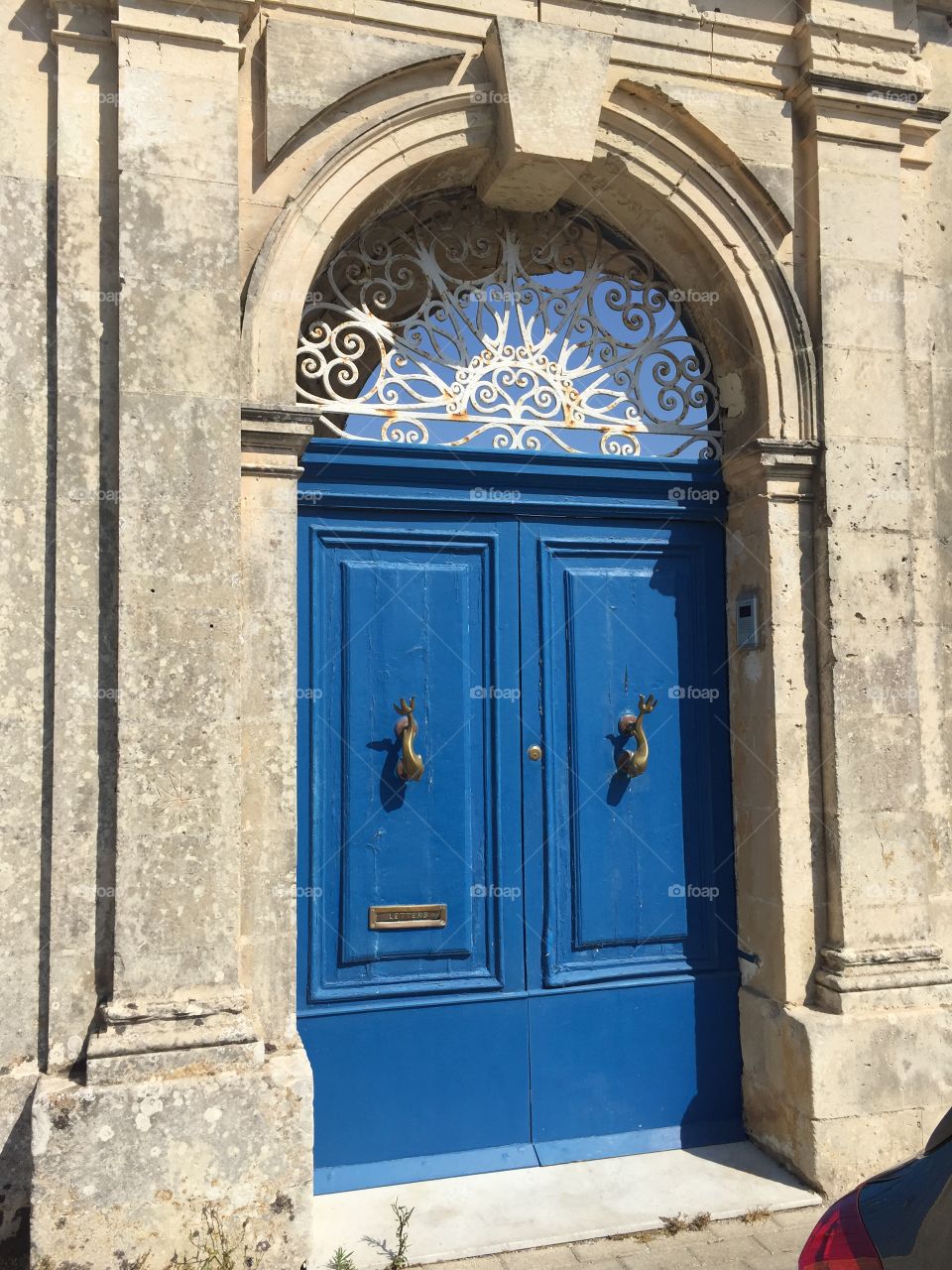 Blue door in archway