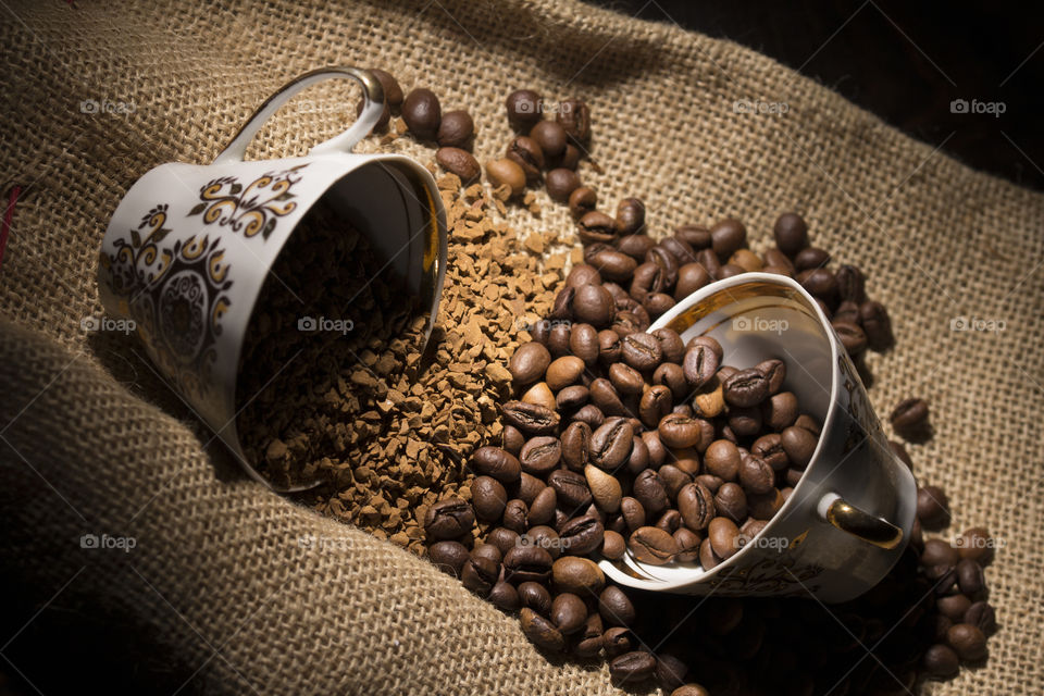 The instant coffee and coffee beans on burlap or sackcloth background

morning ritual concept
