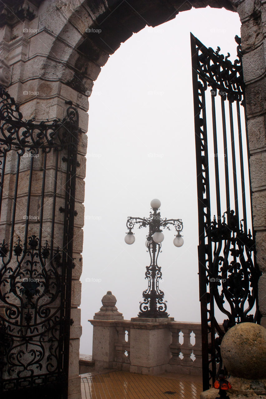 Close-up of gate in fog