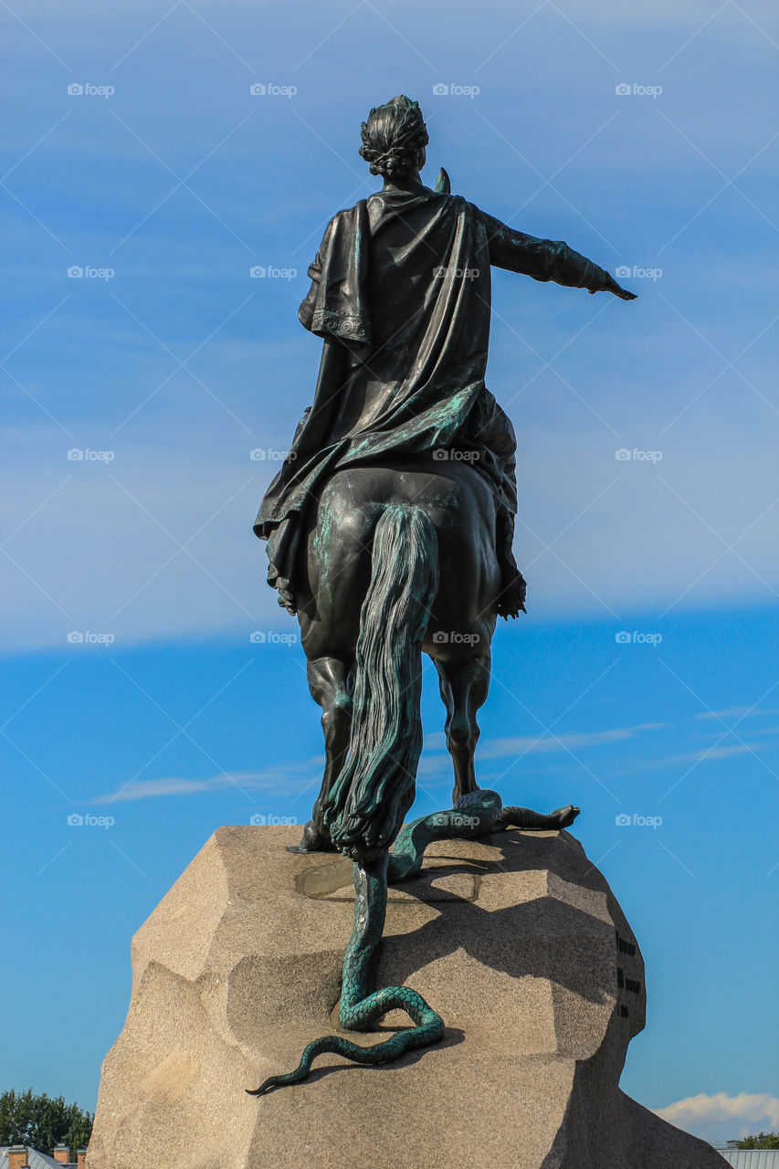 Bronze Horseman in St. Petersburg, view from the back against a blue sky