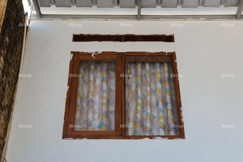 The window with colorful curtain