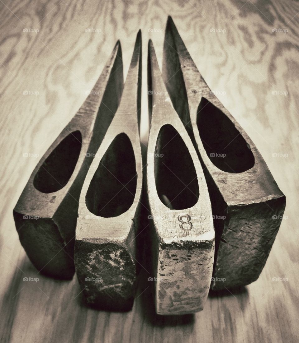 Four axe heads from behind