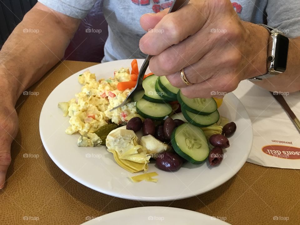 Man eating a nutritious colorful meal.
