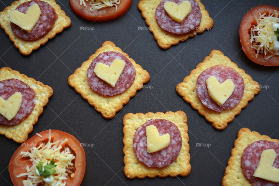 cheese with sausage on a cookie and tomatoes home cooking