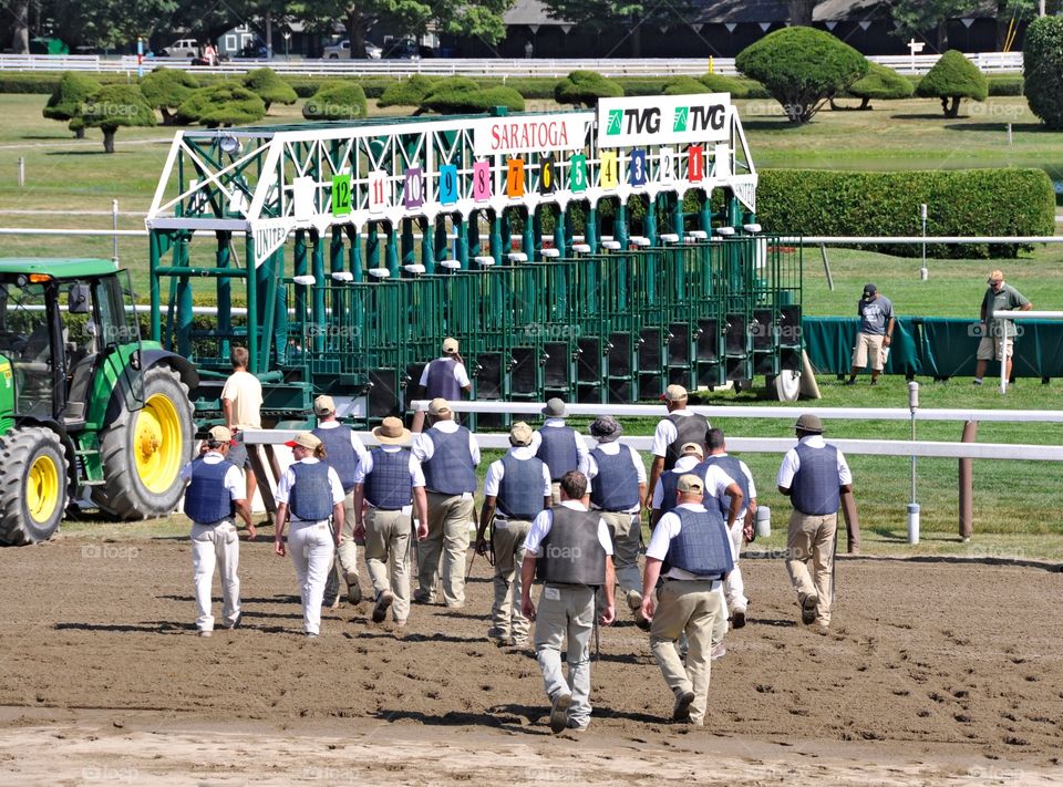 Opening Day at the SPA. Gate handlers prepare for the first race on opening day at Saratoga. Starting gate is prepared to load the racehorses. 