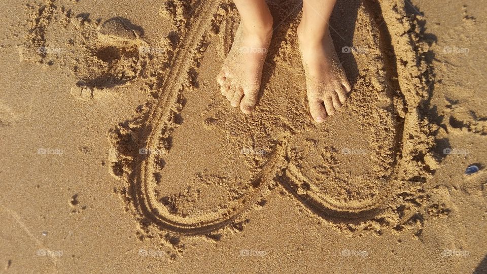 On the beautiful beach of Guincho in Portugal on a sunny windy day.