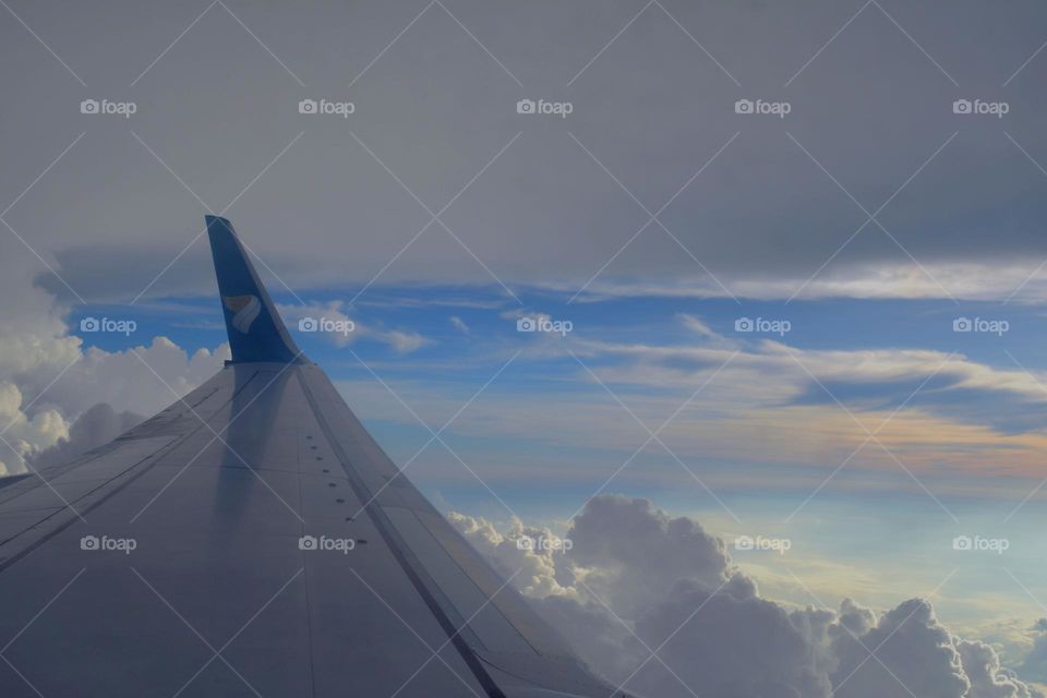 flight window side wings  photographs sky and cloud