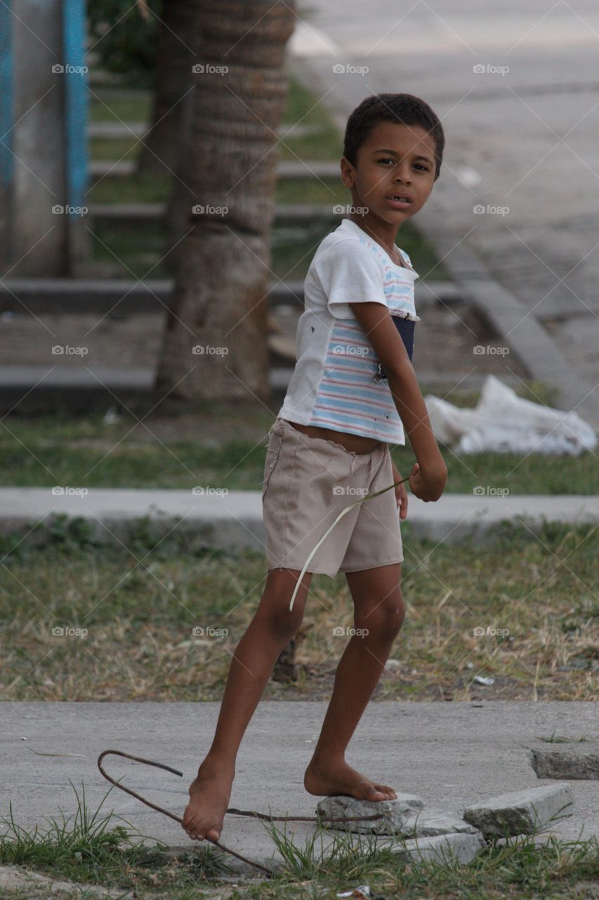 Portrait of Indian boy playing on street