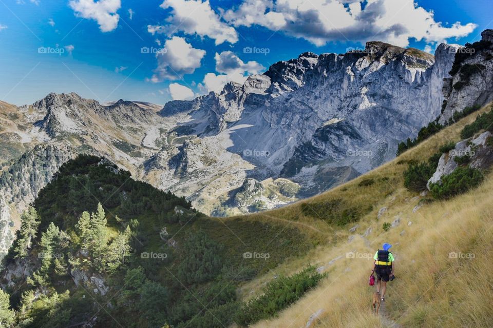 mountain landscape with hiker. 