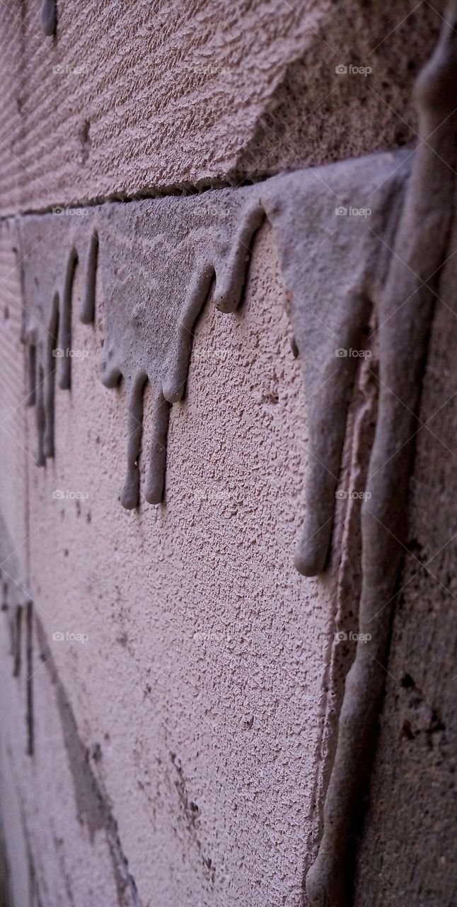 melt cement on the wall