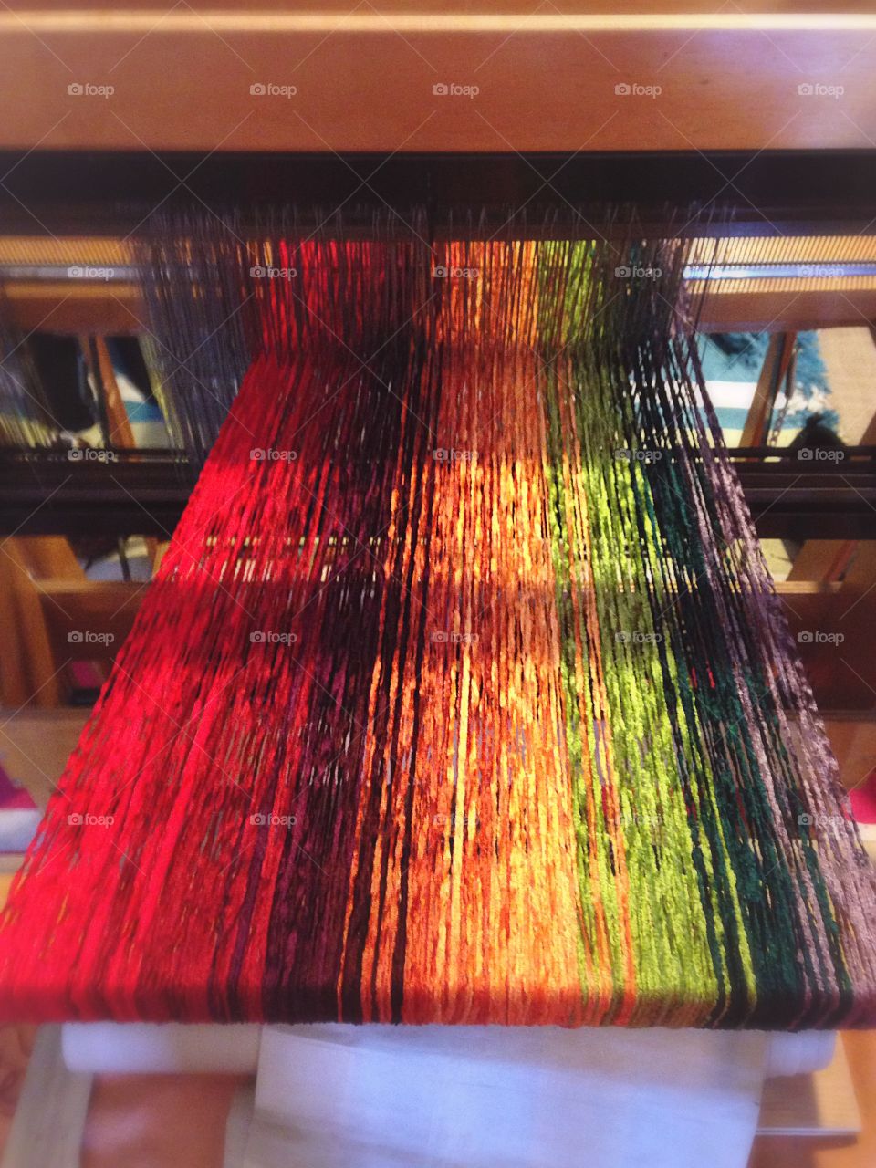Threads weaving on a loom