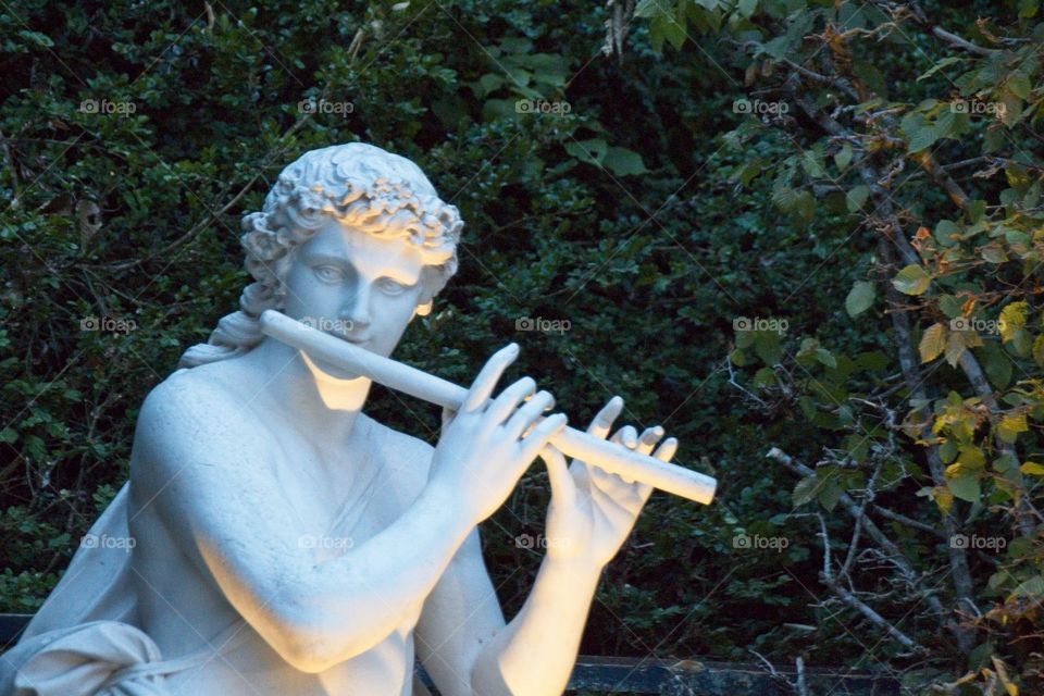 statue of a person in a garden