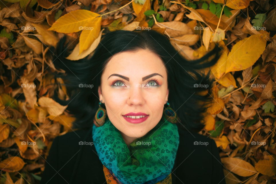 Laying on autumn leaves 